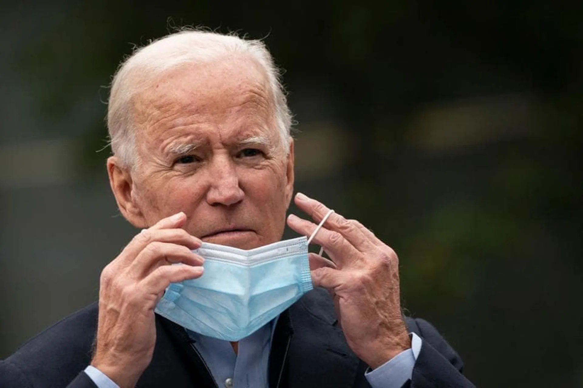 CHESTER, PA - OCTOBER 26: Democratic presidential nominee Joe Biden puts on a face mask while speaking to reporters at a voter mobilization center on October 26, 2020 in Chester, Pennsylvania. In Pennsylvania, Tuesday, October 27 is the last day to request a mail-in ballot or to vote early in person. (Photo by Drew Angerer/Getty Images)